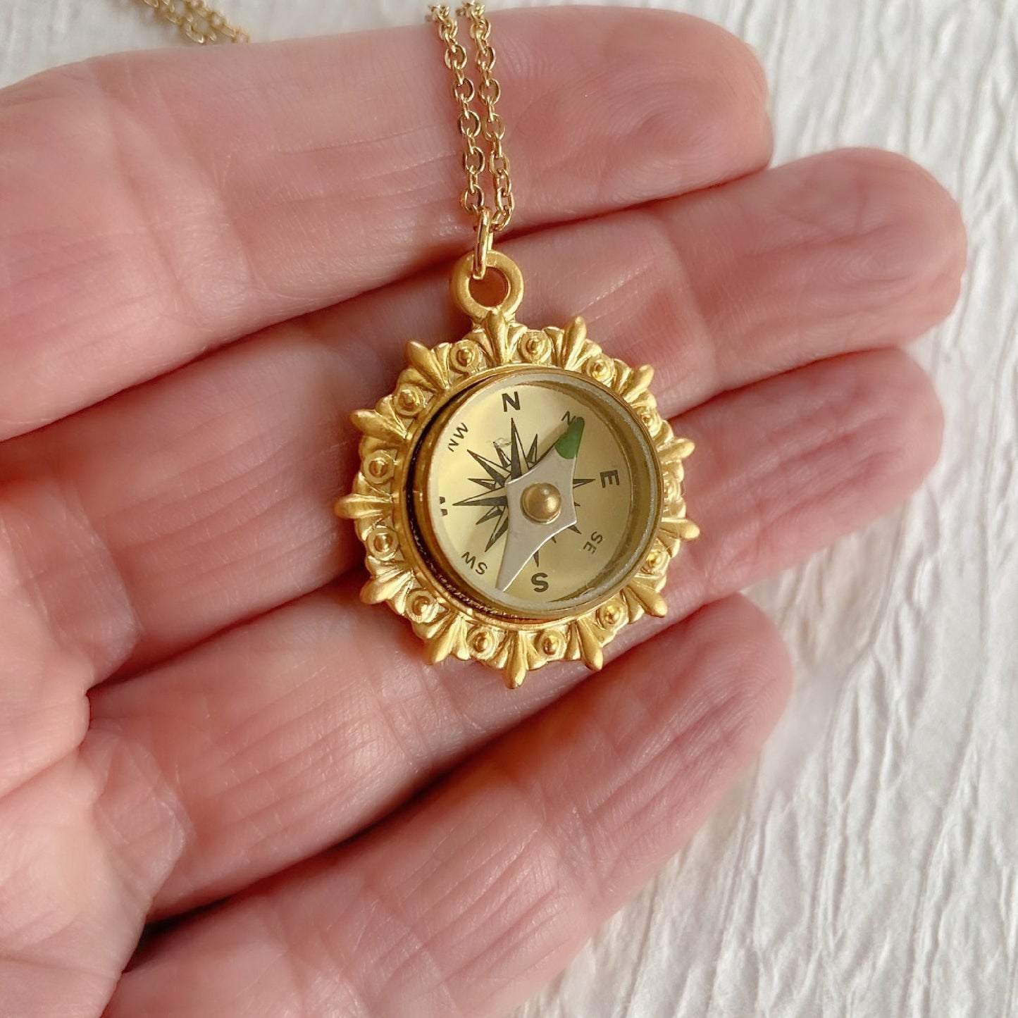 gold working compass pendant