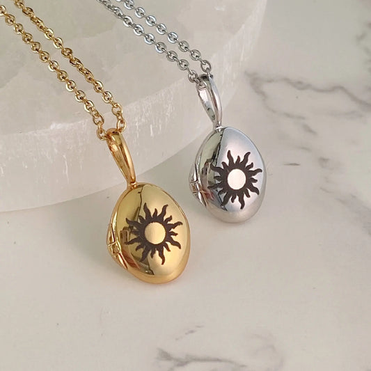 sunburst oval photo locket in gold and silver